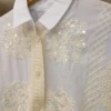 Camisa con apliques