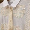 Camisa con apliques